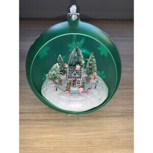 Animated Lighted Musical Ornament Plastic Gingerbread House Green Countertop